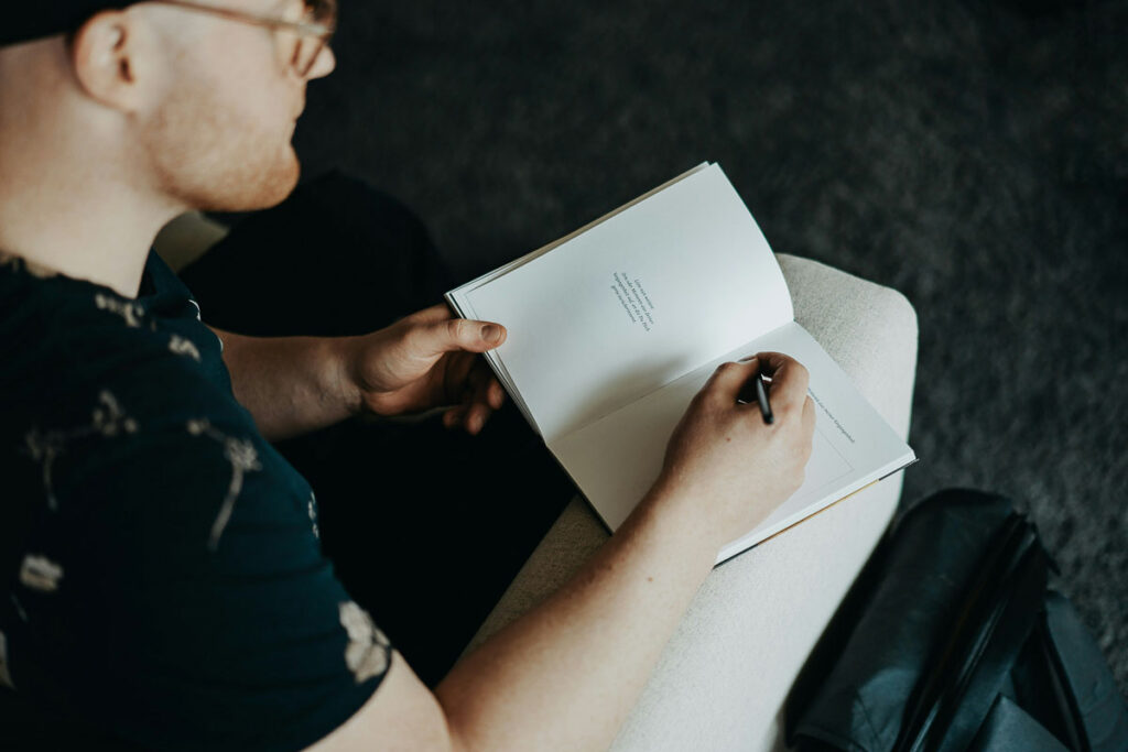 A man writes in his journal about overcoming mindset blocks. 