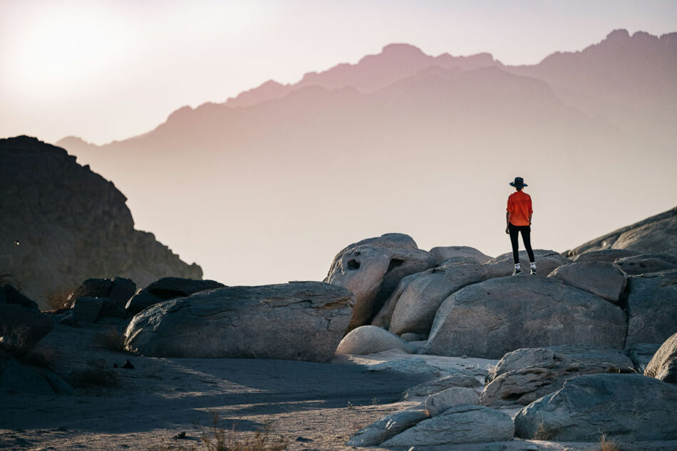 A woman gazes at a beautiful natural landscape.